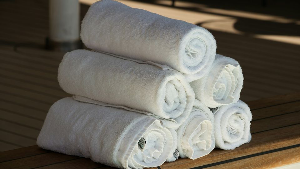 Rolled white hotel towels